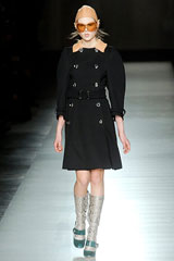 Black coat with silver boots by Prada